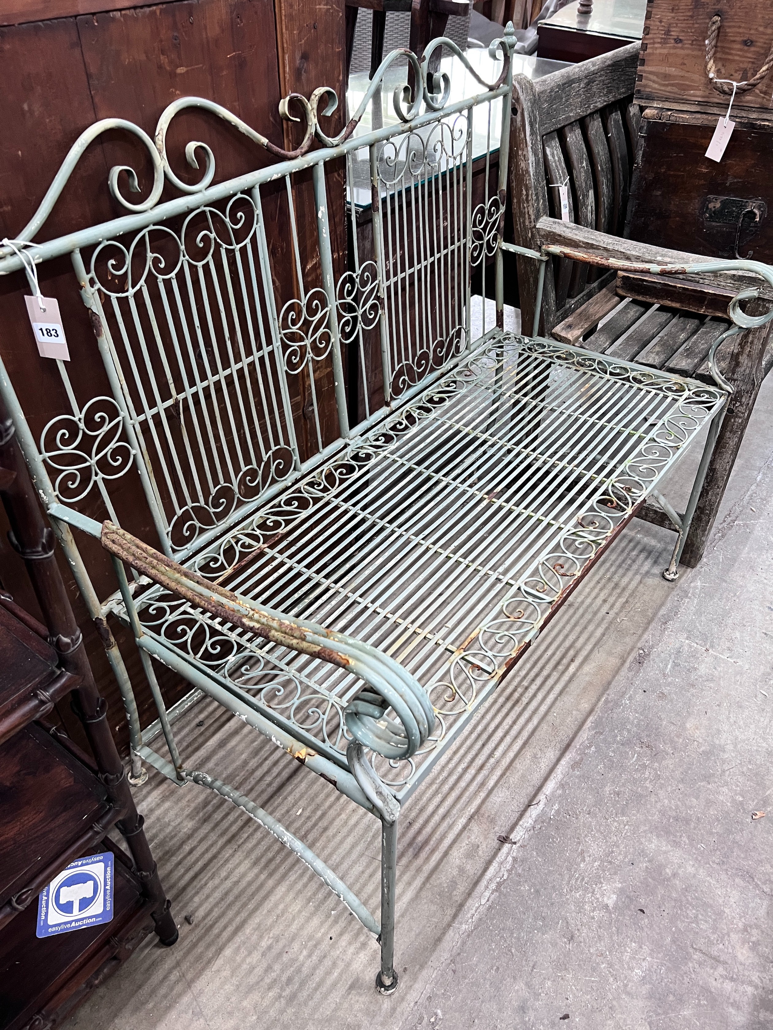 A painted wrought iron folding garden bench, width 108cm *Please note the sale commences at 9am.